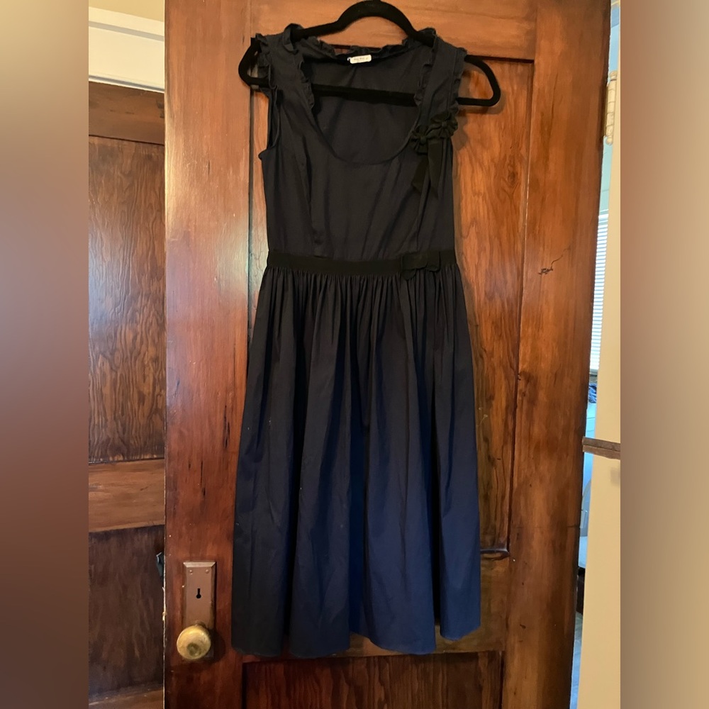 Elegant midnight blue MUI MUI dress w/ black ribbon trim, flower detail, ruffle